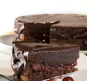 Chocolate cake with strawberry confiture and chocolate glaze