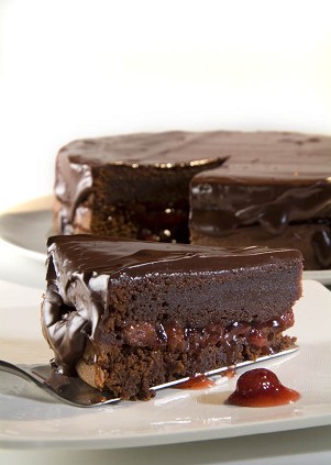 Chocolate cake with strawberry confiture and chocolate glaze